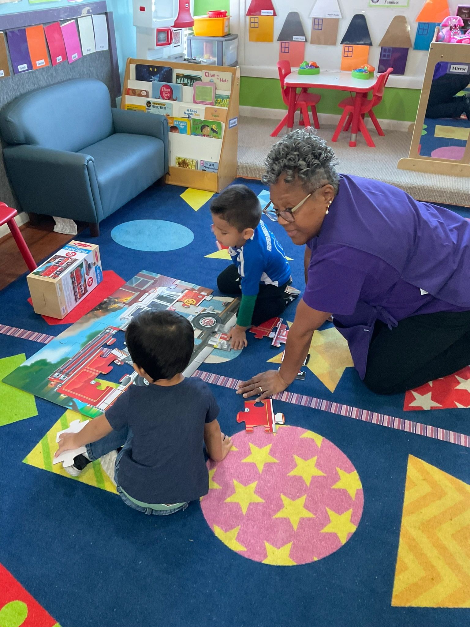 Teacher engaging with children in classroom